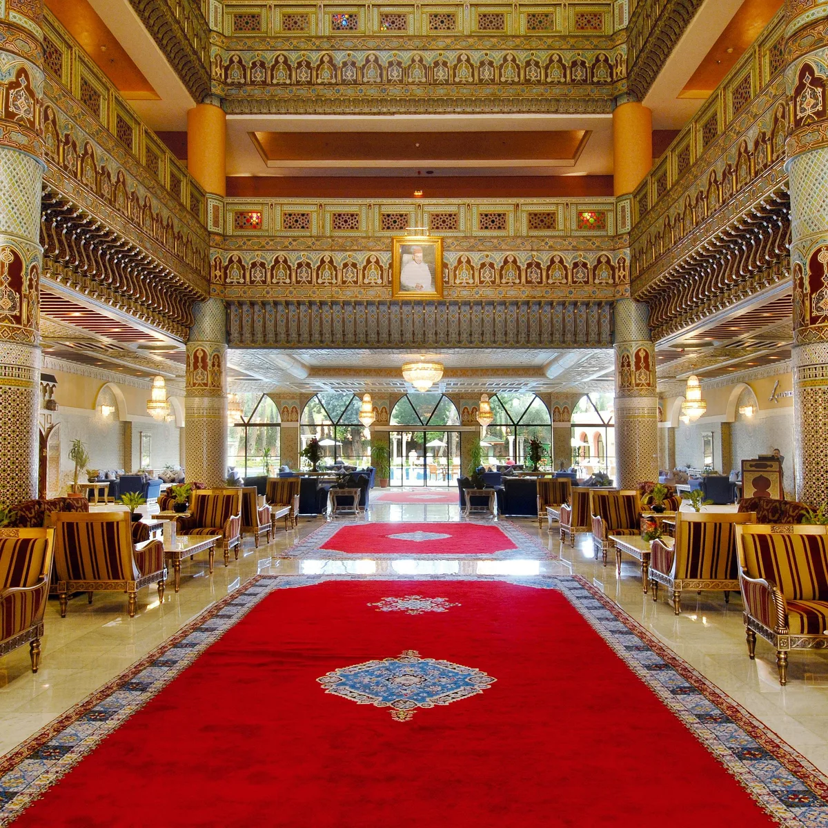 The Grand Monarch Hotel lobby with restored marble floors and crystal chandelier